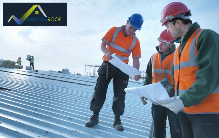 Roofer inspecting reflective roofing material for energy efficiency